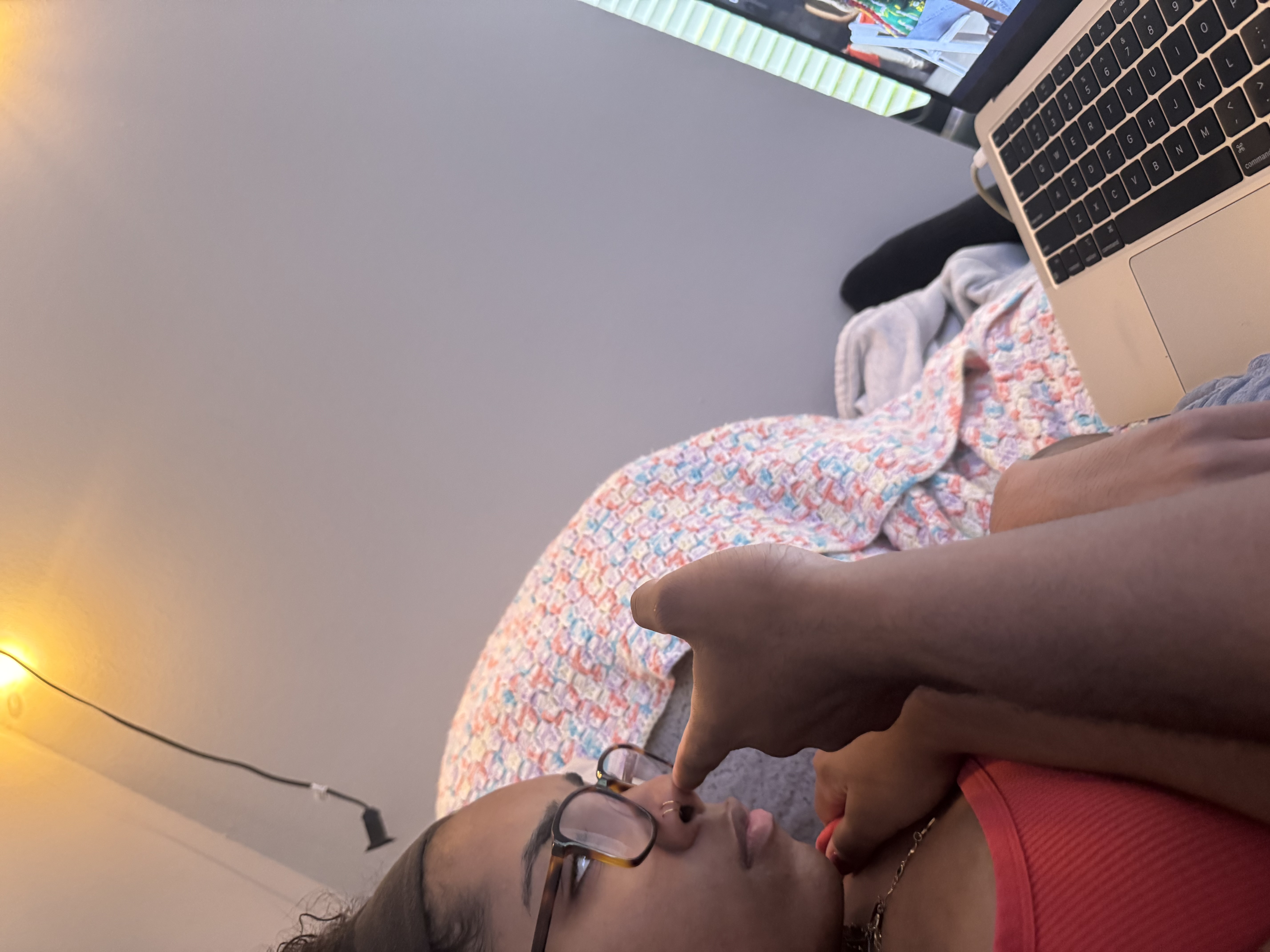 A playful candid moment while Jaden's girlfriend uses a laptop