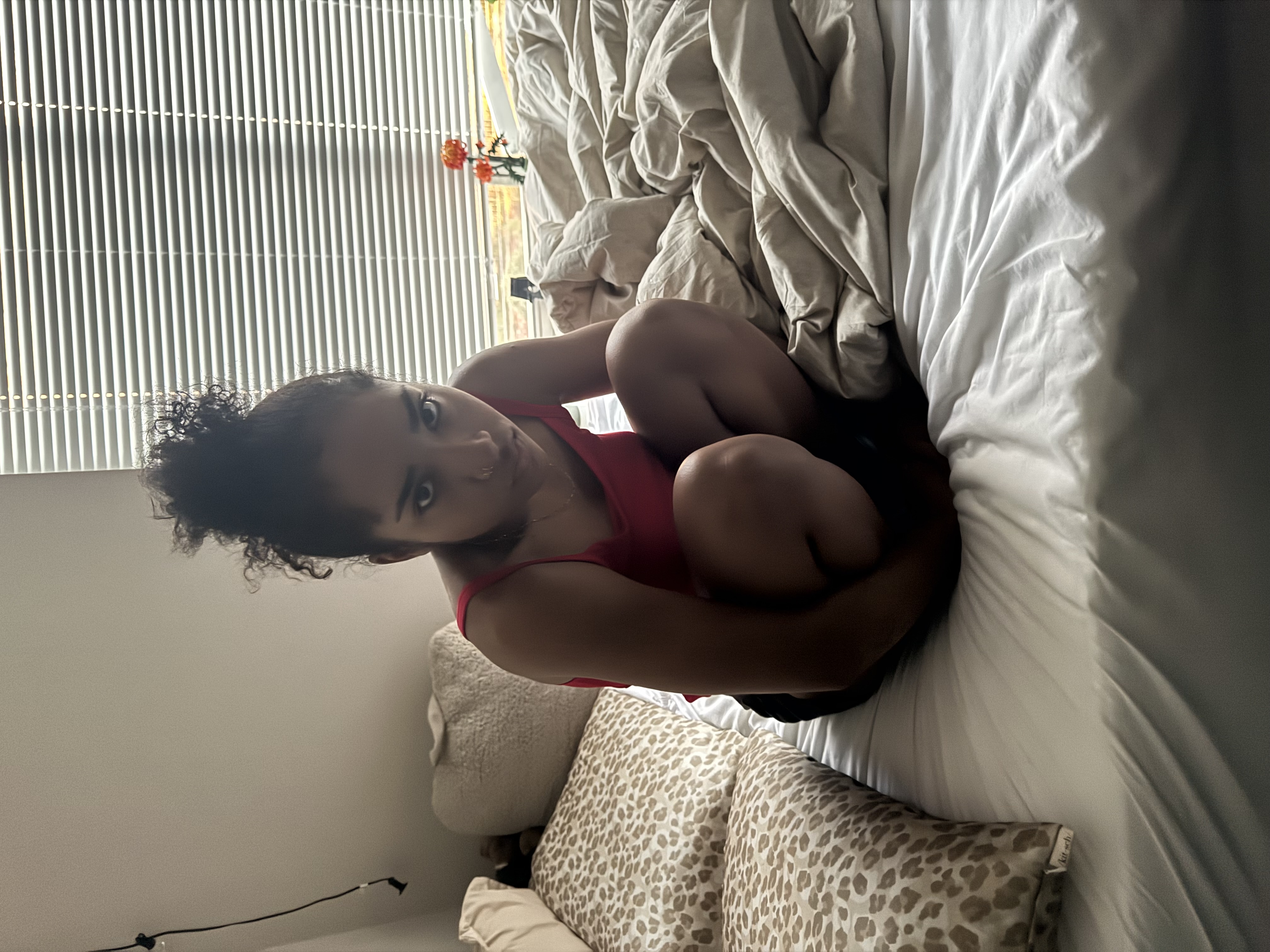 Jaden's girlfriend relaxing on a bed