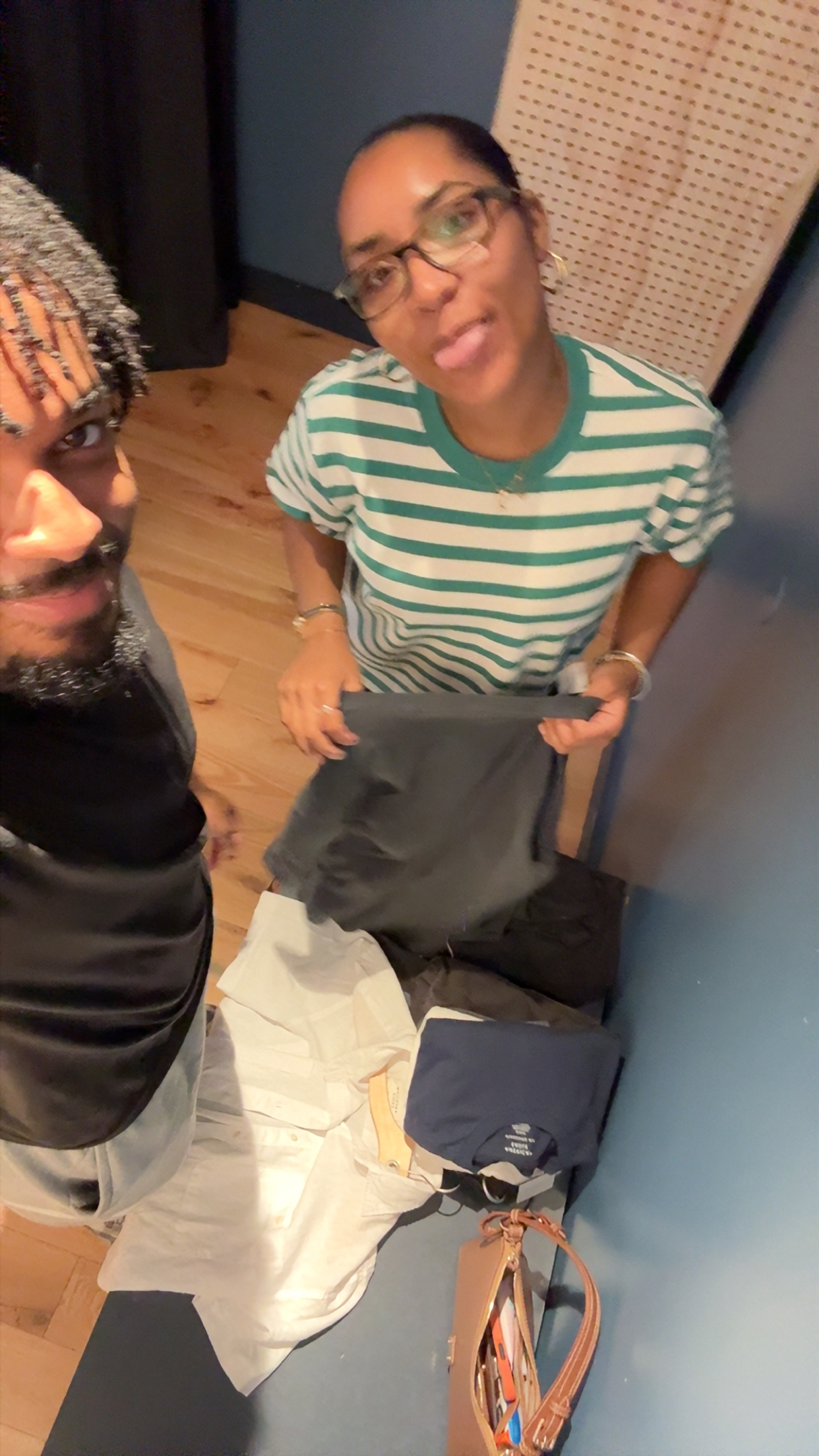 Jaden and his girlfriend making playful faces in a fitting room